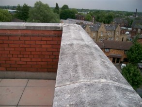 Gaps between coping stones allowing moisture into the wall and building below Gaps between coping stones allowing moisture into the wall and building below